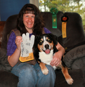 Data and Joyce posing with their signed Tracking glove and ribbons for earning the title