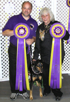 Pat, Dax & Arda posing with the DPCA Top 20 Ribbons